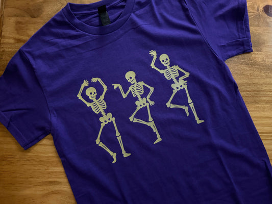 Dancing Skeletons Tee – Purple with Mustard Yellow Design