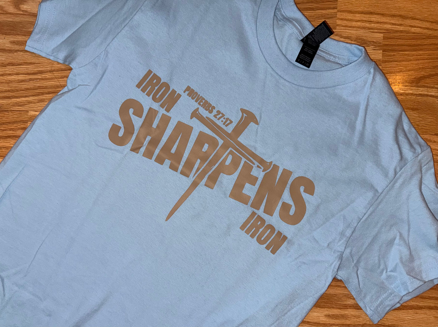 Iron Sharpens Iron Tee – Proverbs 27:17 Graphic Tee